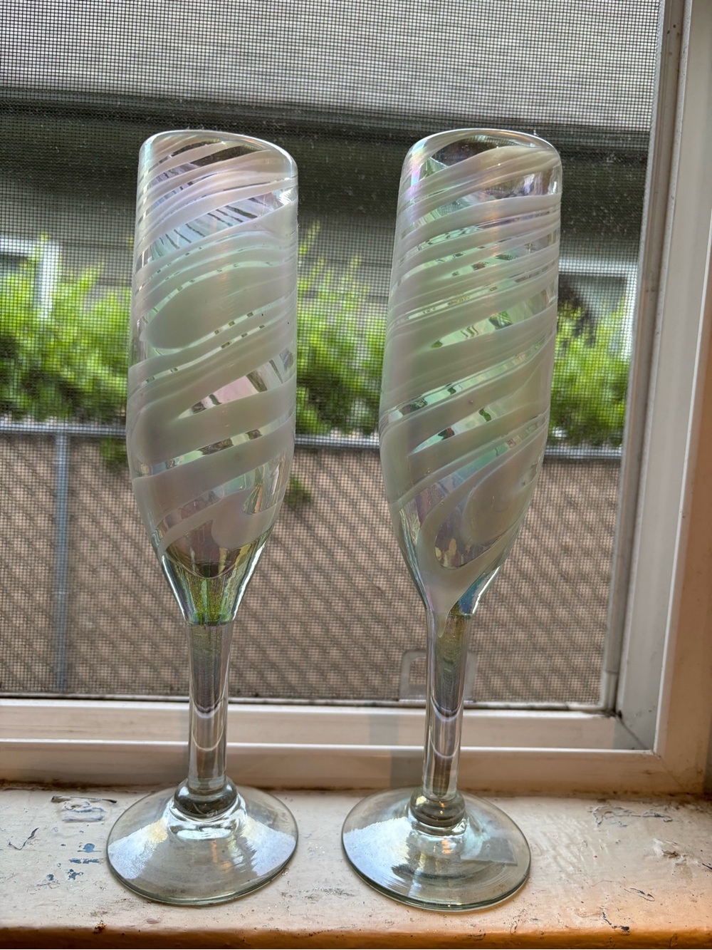 Two champagne flutes. Handmade.  Iridescent.